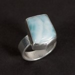 A lovely blue larimar stone in a textured sterling silver ring.