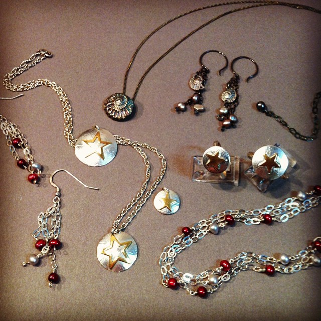 Some old favorites from Peggyâ€™s jewelry line: Gold Stars, Ammonites, and pearls.